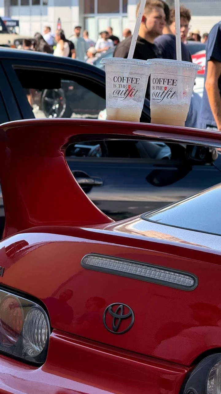 Toyota Supra spoiler with coffee cups before editing