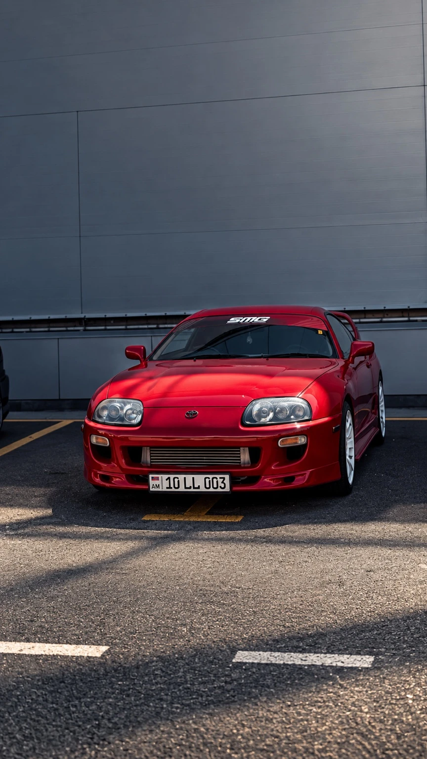 Red Toyota Supra, front view after editing